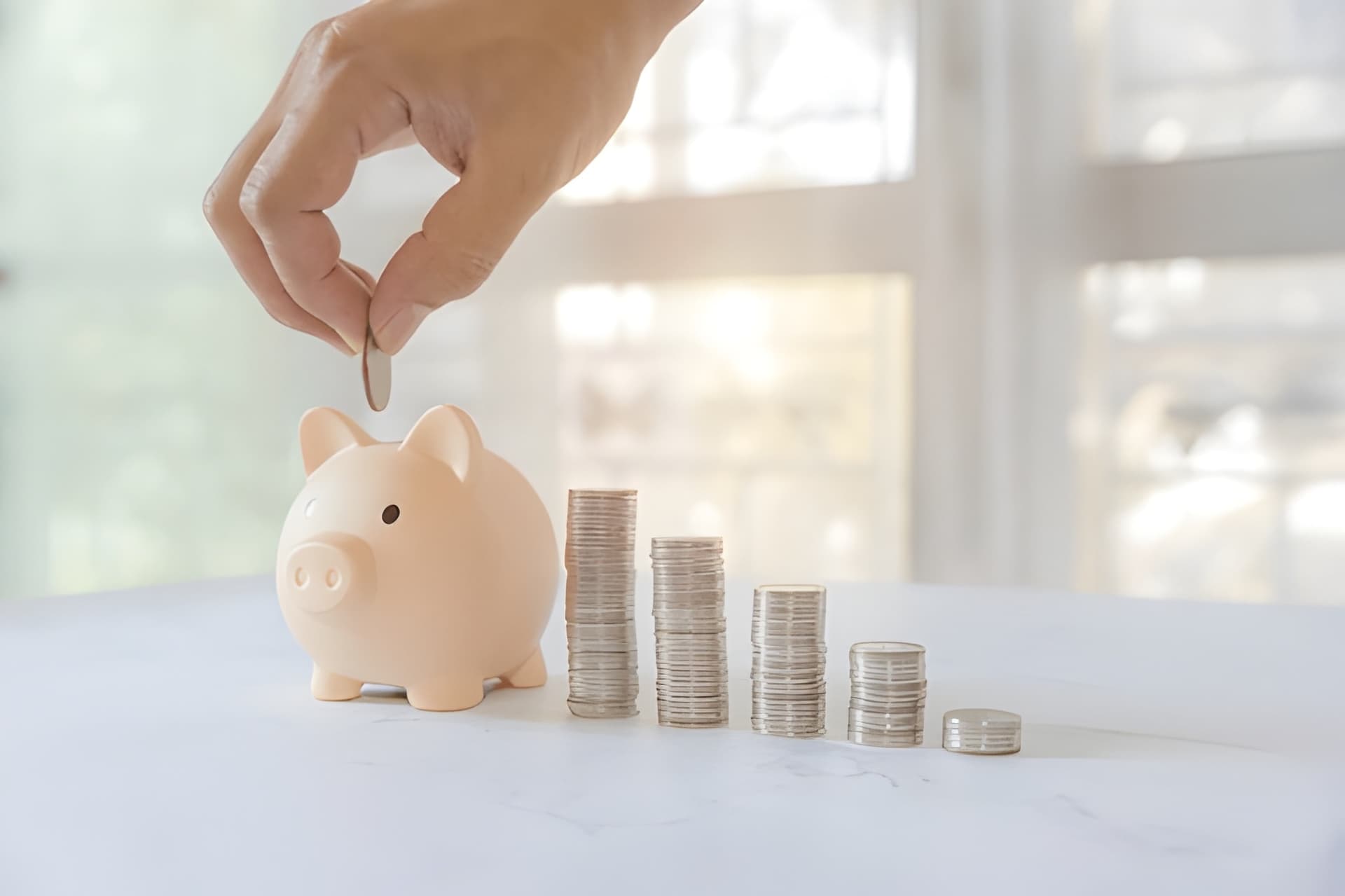 Person reviewing savings plan documents with calculator and laptop, highlighting common financial planning mistakes to avoid.