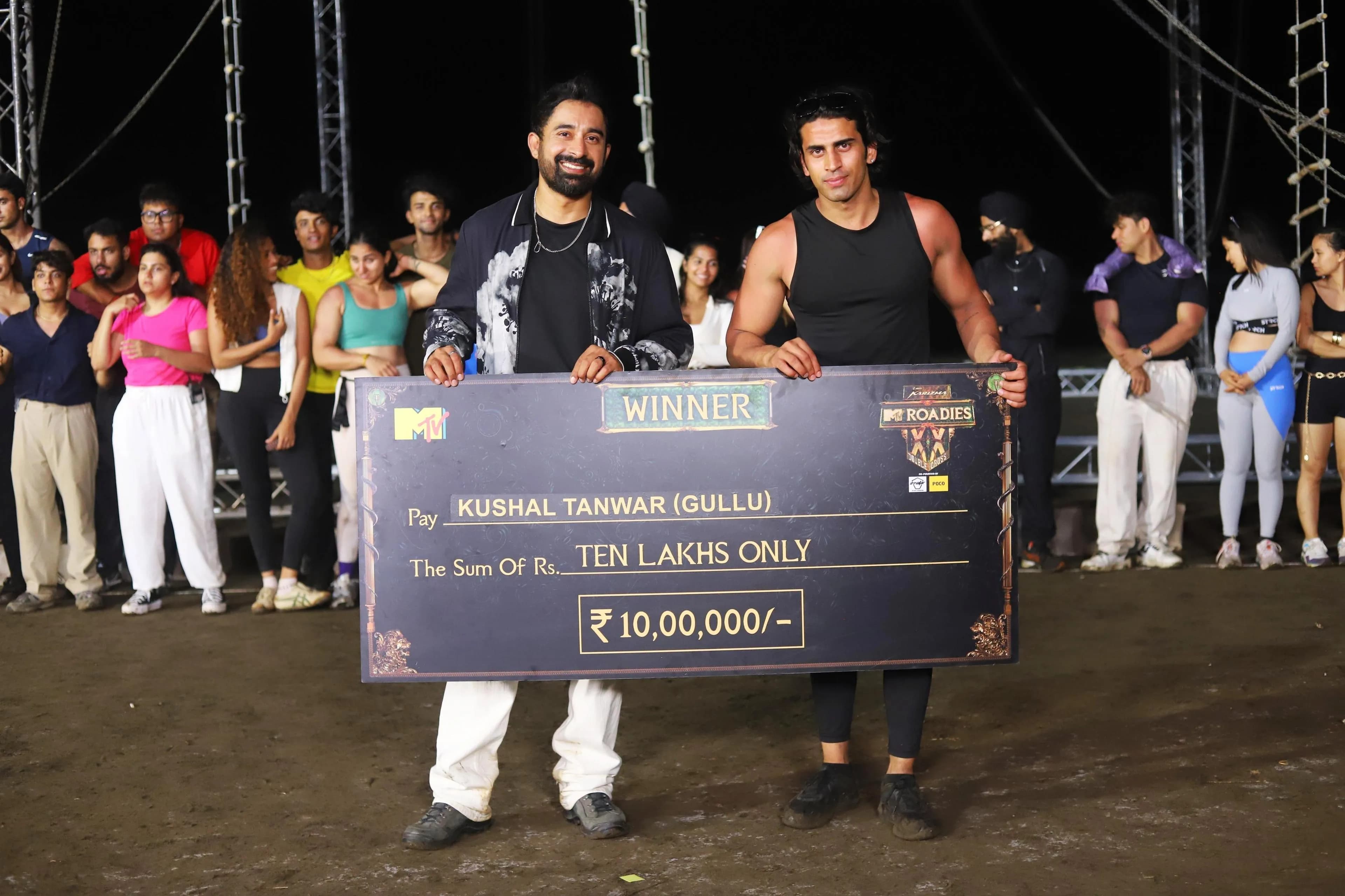 Elvish Yadav and Kushal Tanwar (Gullu) celebrating their MTV Roadies XX victory while holding the winner’s trophy together.