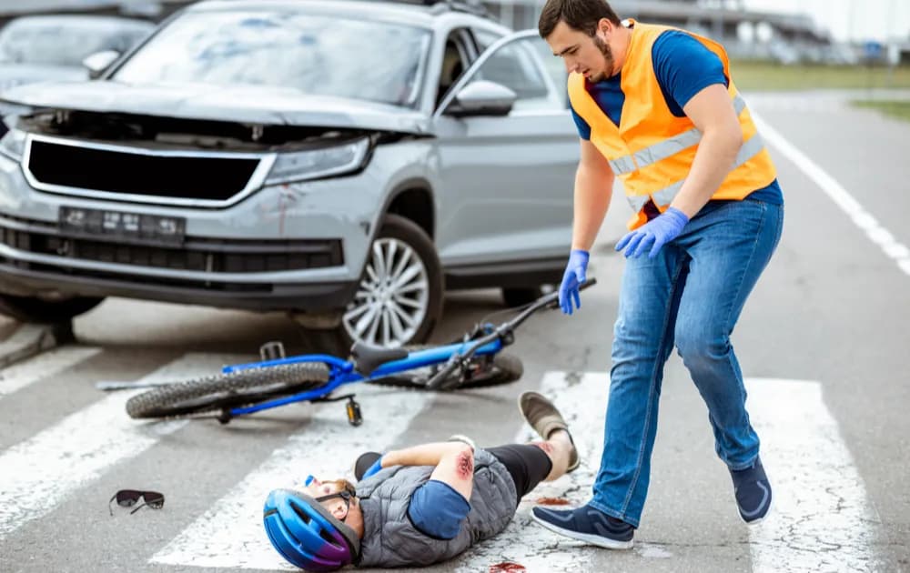 Damaged bicycle at crash scene showing bent wheel and frame damage used to investigate accident impact and cause.